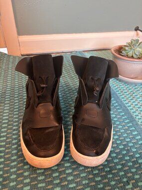 one-of-a-kind RARE NIKE designer high-tops. Toggle closure. Custom leatherwork.